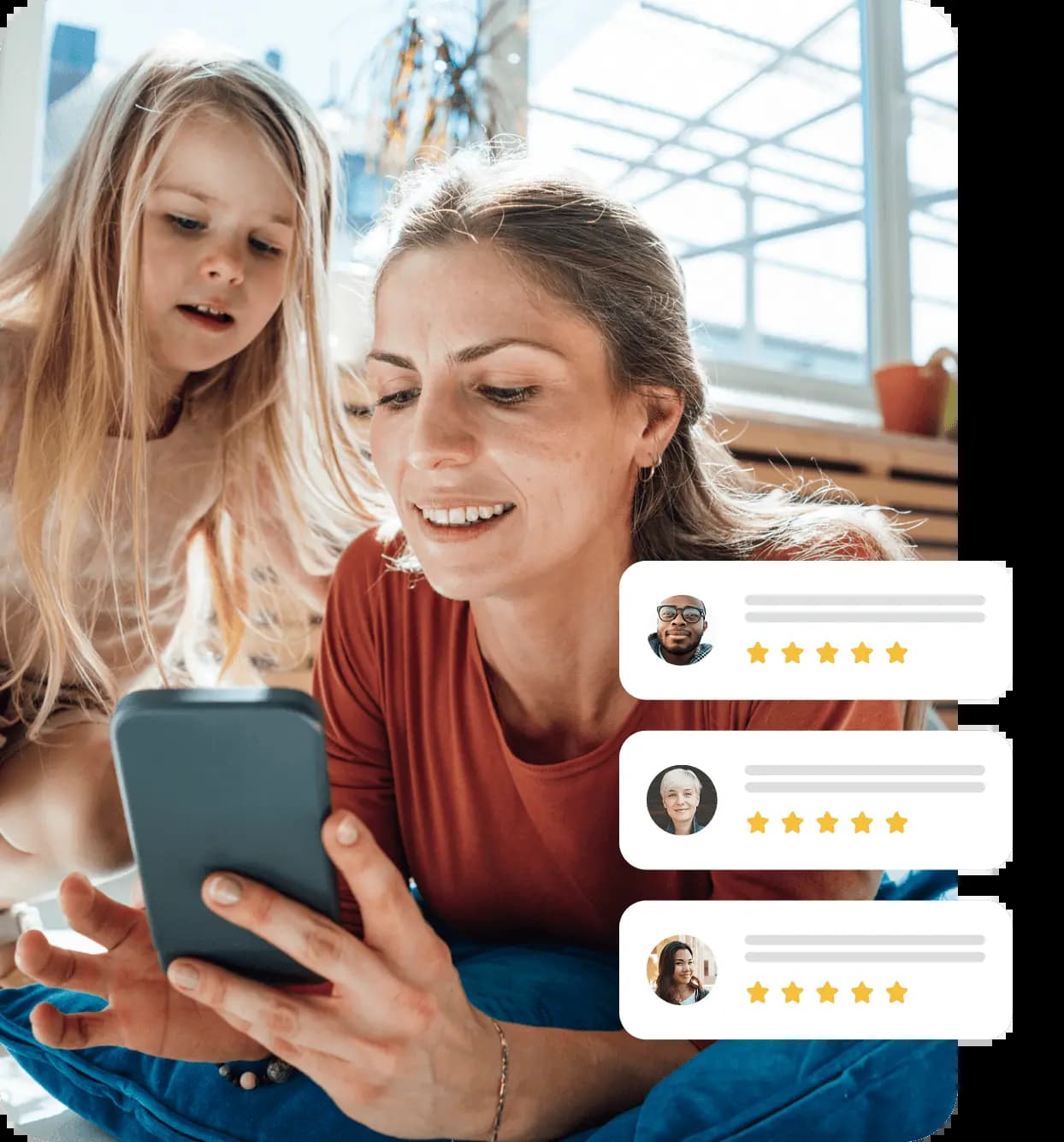 Mother sharing phone with daughter