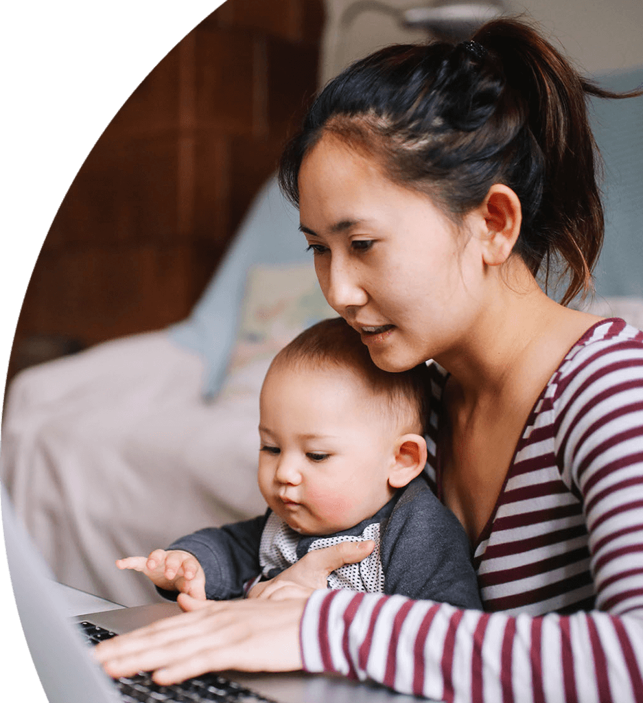 Working mom with child looking online for benefits