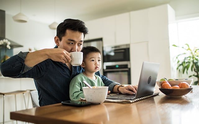 dad looking up child care benefits