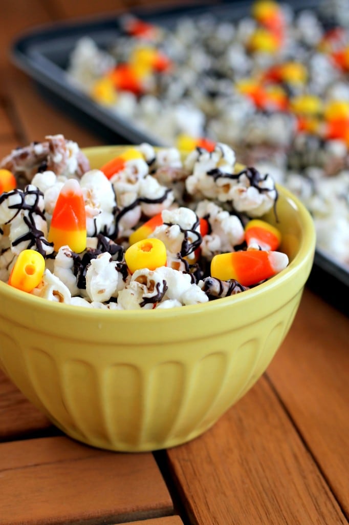 White chocolate candy corn popcorn is delicious Halloween party idea.