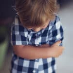 toddler boy in trouble for hitting
