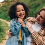 Babysitter with young child having fun.