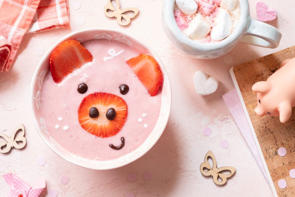 Fruit pig face in strawberry yogurt for kids snack