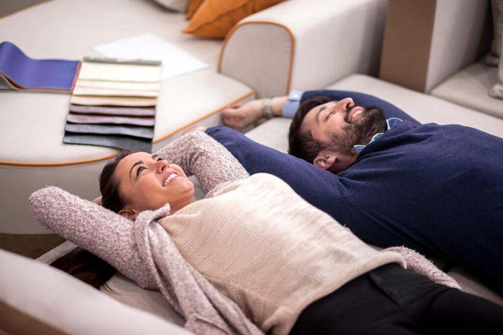 Young couple goes mattress shopping as a cheap date night