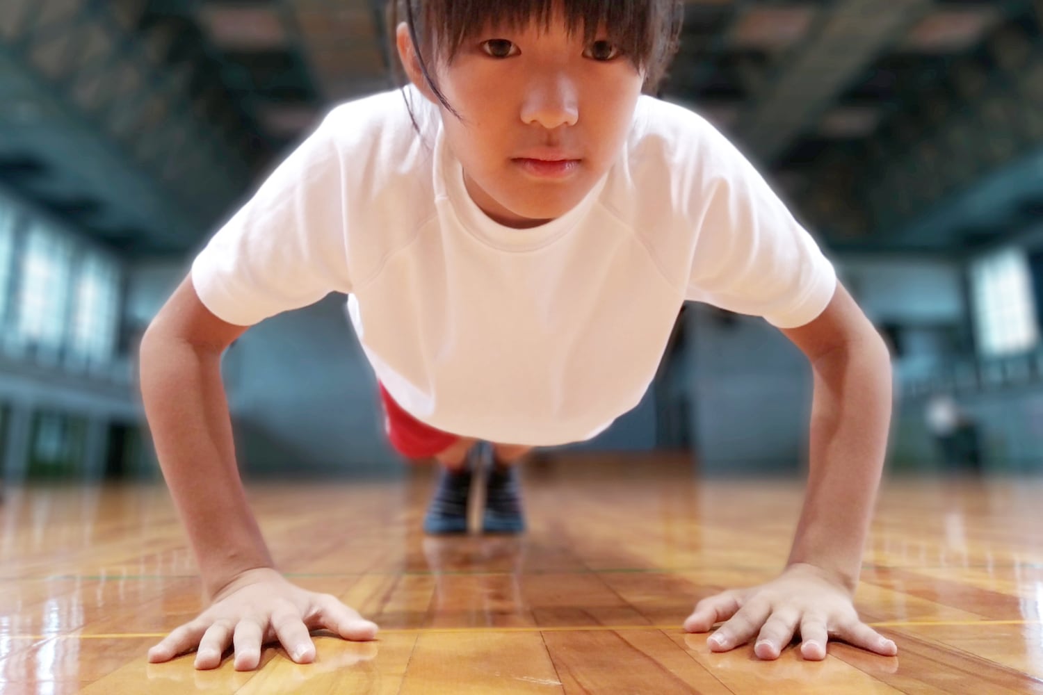 Photo of mom making son do pushups on bathroom floor sets off discipline debate