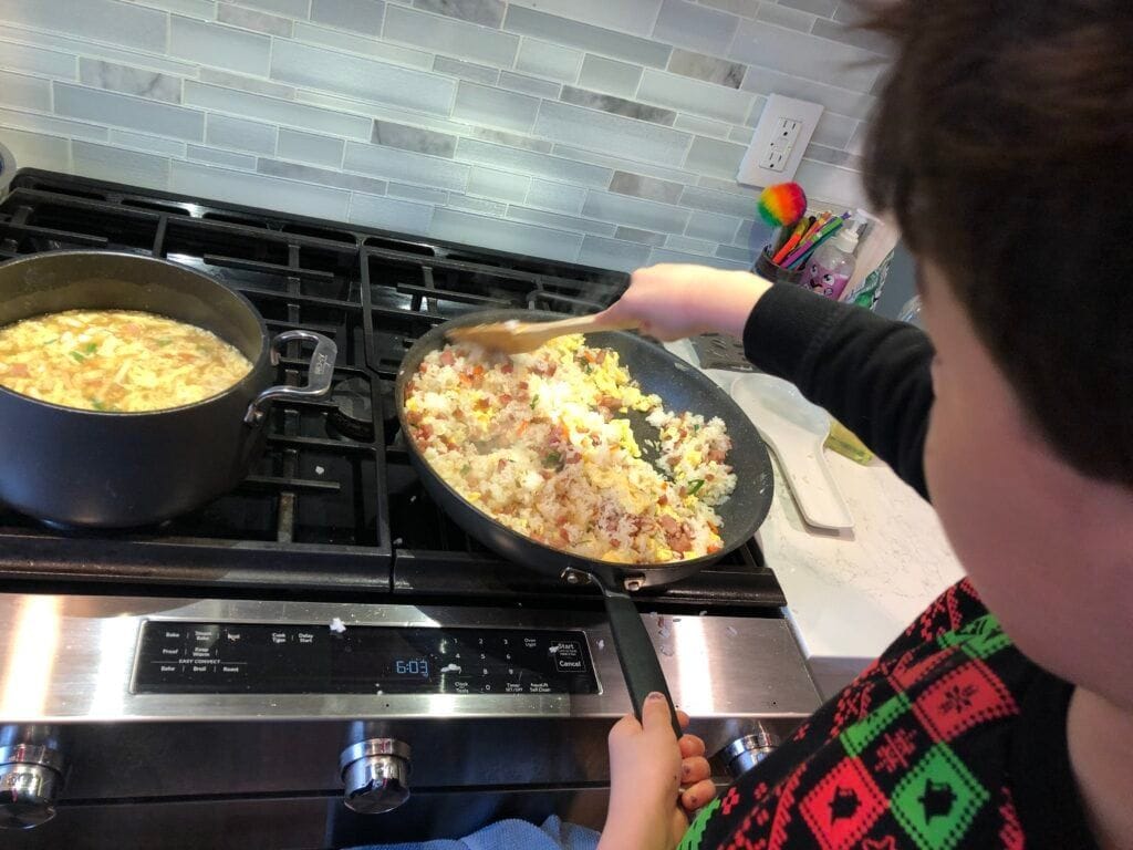 Child cooking fried rice