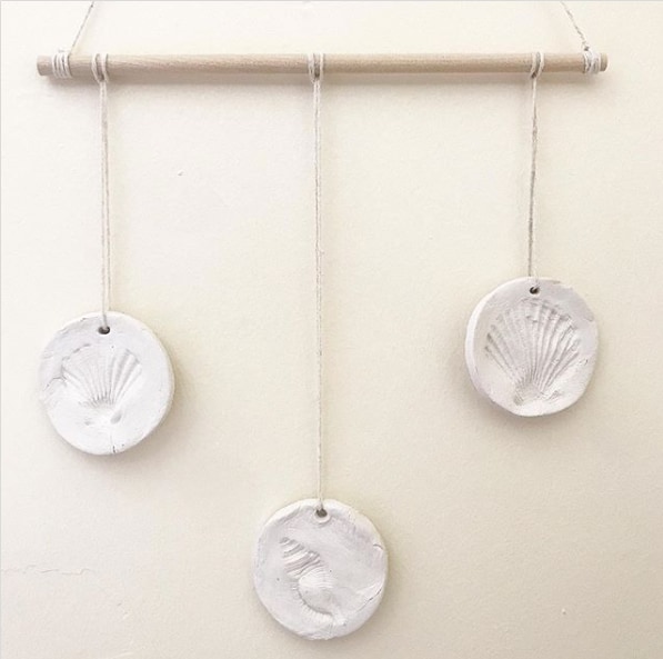 These clay shell wall hangings make a fun summer craft activity for kids.