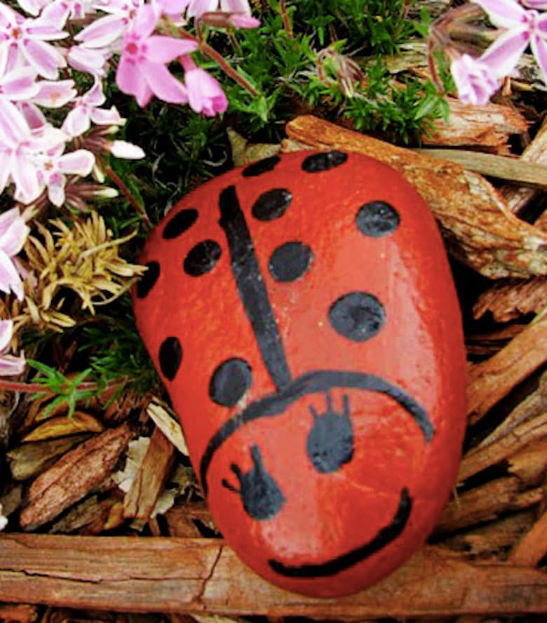These DIY painted ladybug garden rocks are a Mother’s Day gift that kids can make