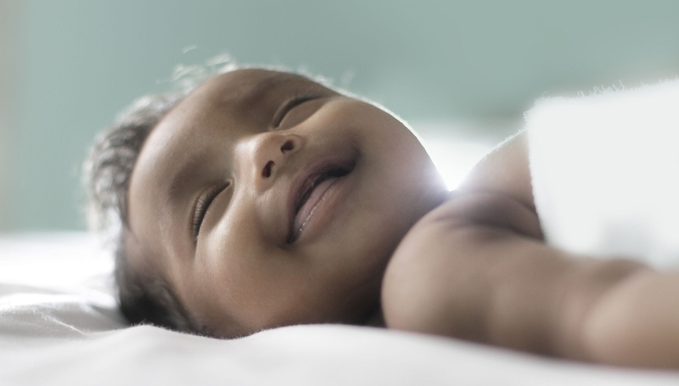 What age do babies sleep through the night? Here’s what experts say