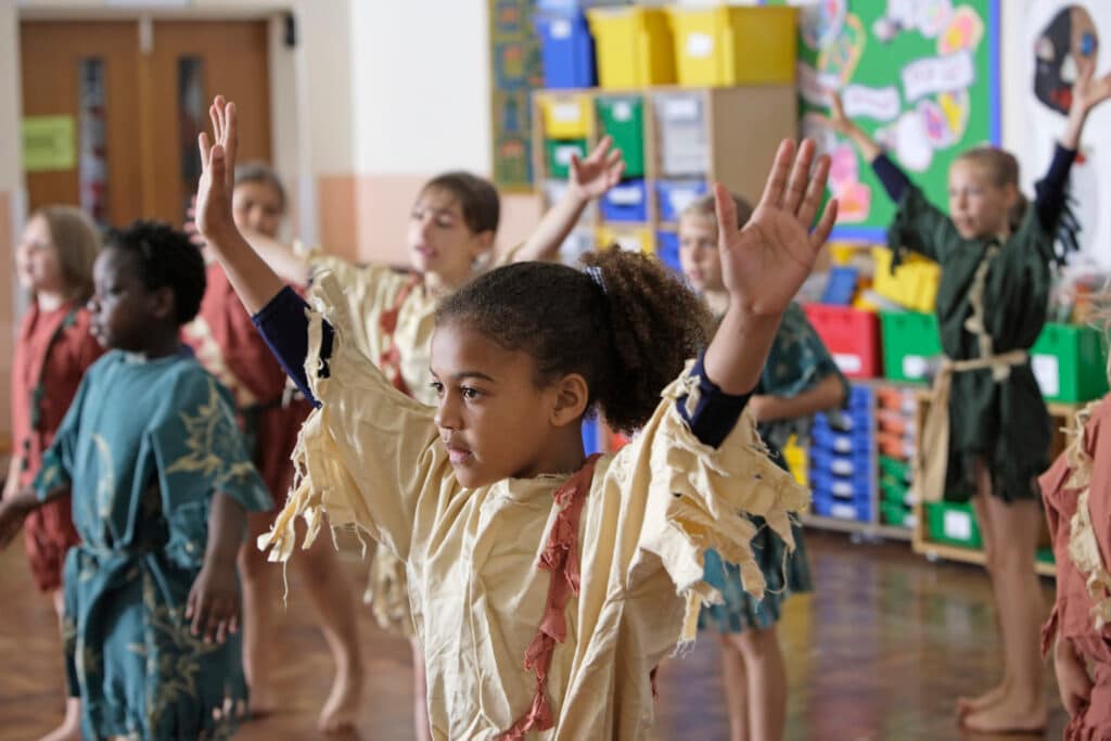 school children in drama class