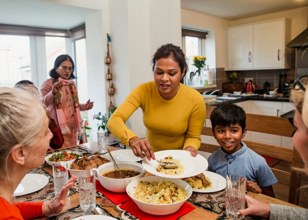 Muslim family enjoying food together during Ramadan