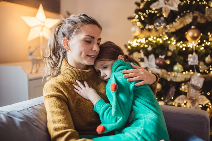 mom comforting daughter who is upset about Santa 'naughty or nice' list