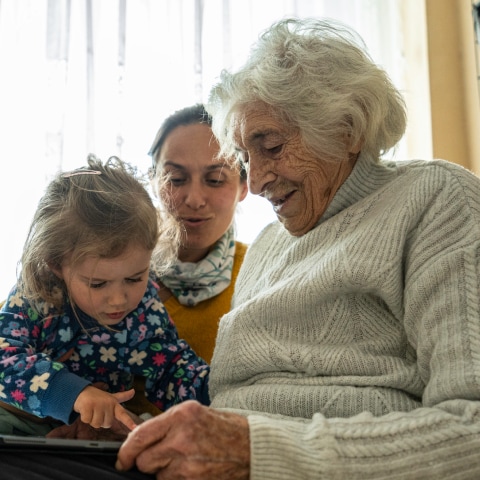 Caregiver with child and senior