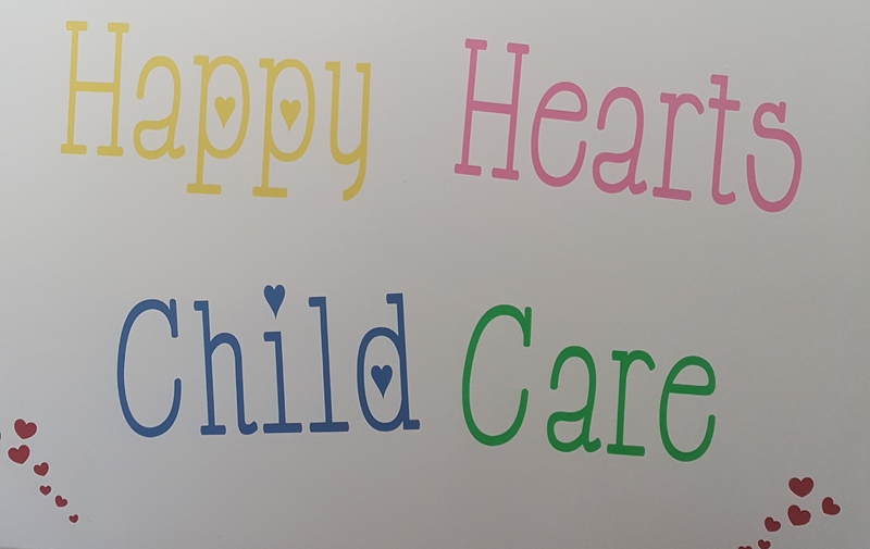 Happy Hearts Child Care Logo